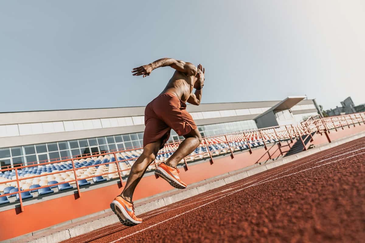 A runner sprinting on a track.