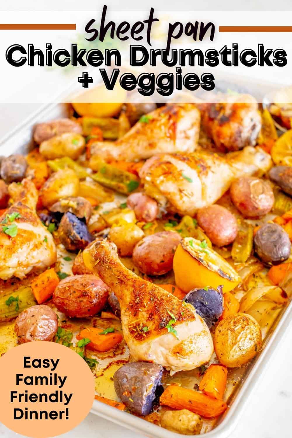 A sheet pan with cooked chicken drumsticks and vegetables, with a text overlay with the name of the recipe.
