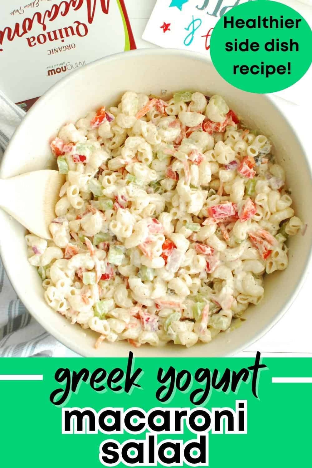 A bowl of greek yogurt macaroni salad with a text overlay with the name of the recipe.
