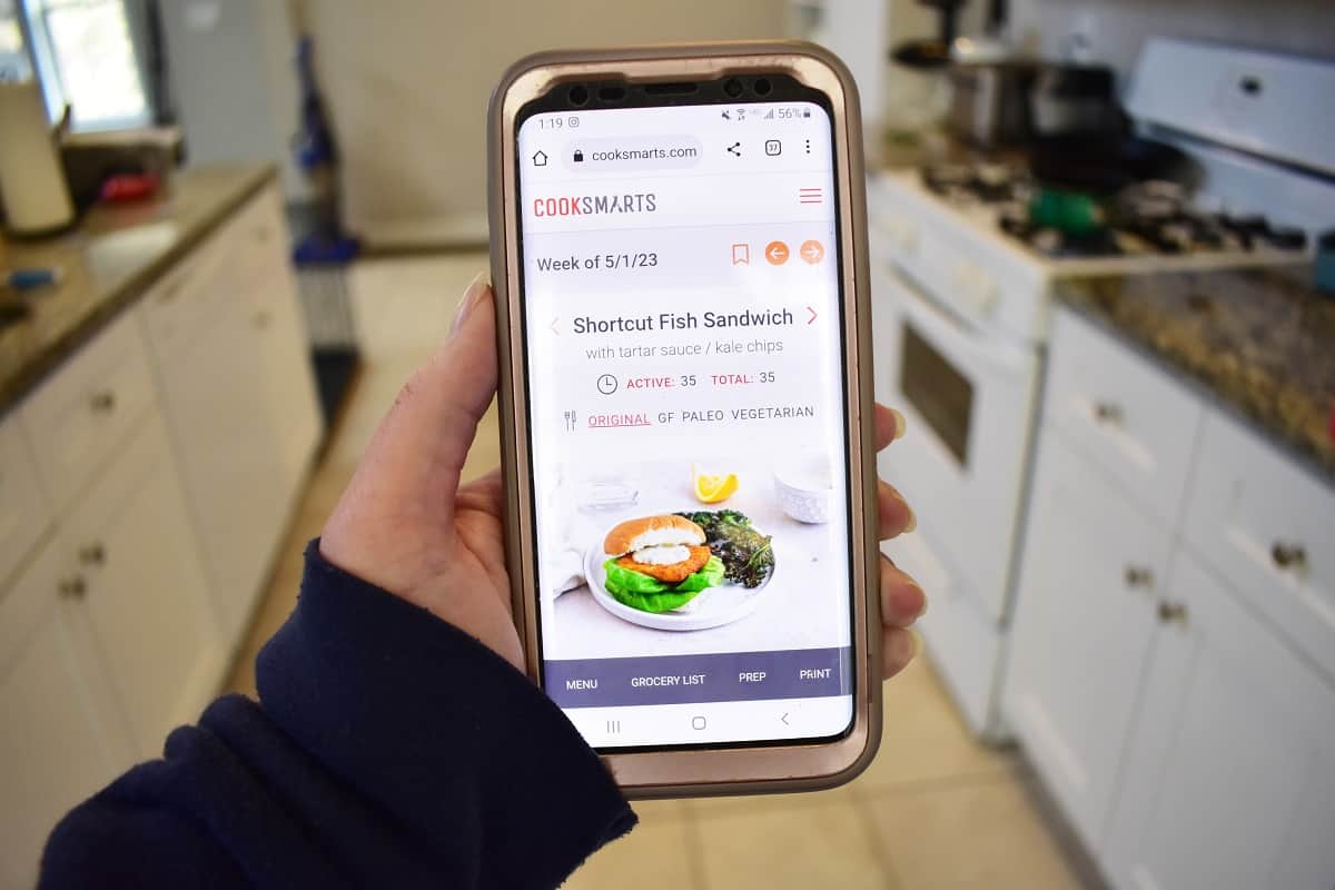 A phone in a kitchen displaying a Cook Smarts meal plan.