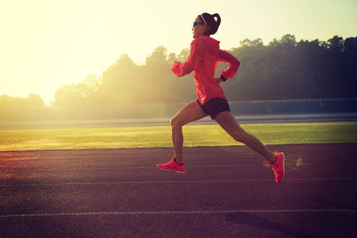 A woman doing intervals on a track.