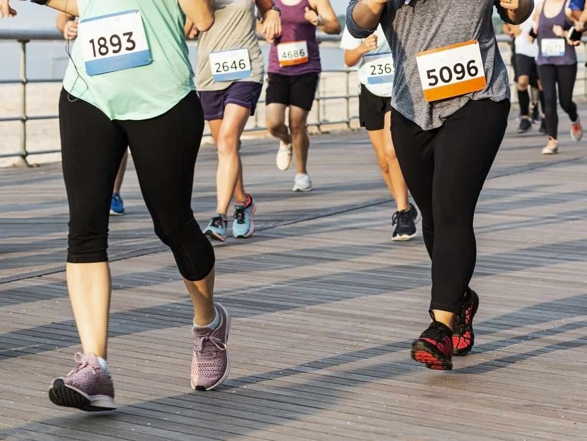 A group of runners in a 5K road race.