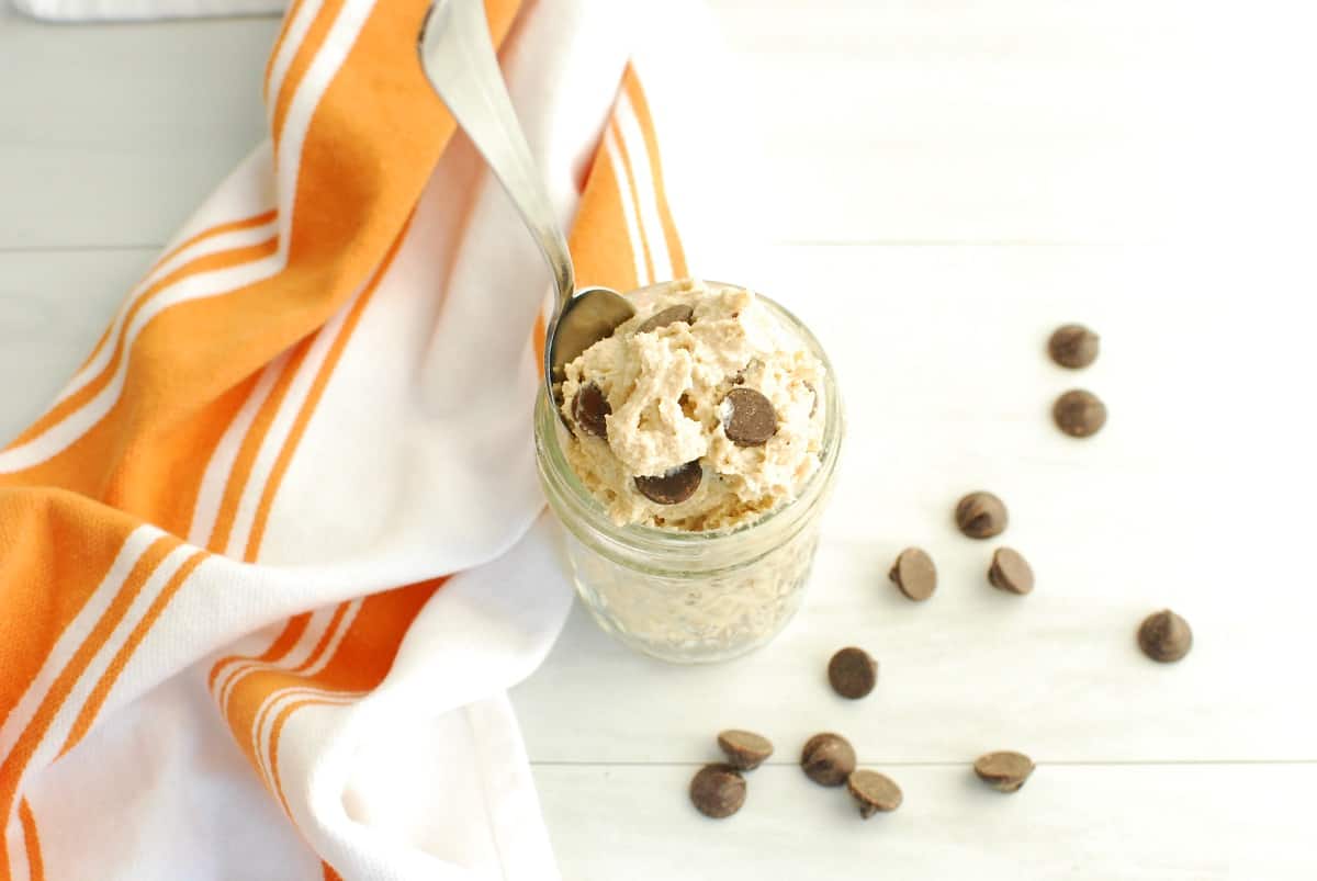 A top-down shot of a mason jar filled with cottage cheese cookie dough.