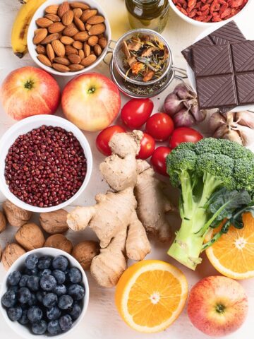 A variety of flavonoid-rich foods for runners like citrus, chocolate, apples, and berries.