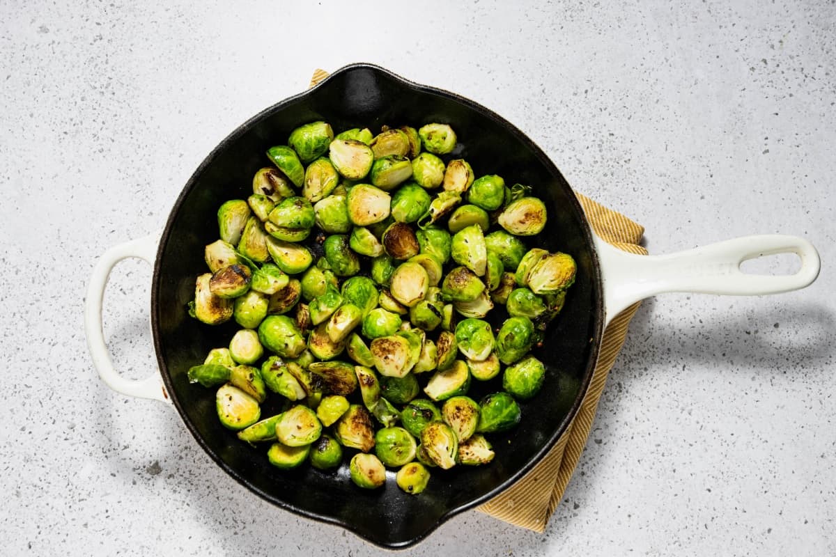 Brussels sprouts after being sautéed in a skillet.