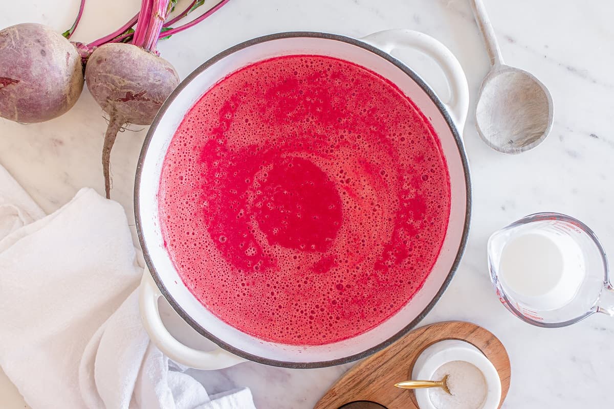 The pot of blended creamy beet soup.