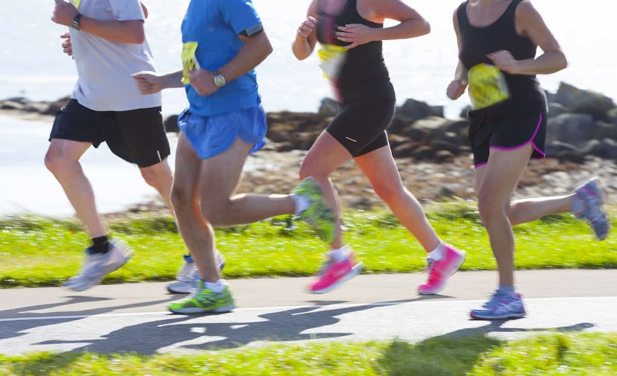 A group of runners in the middle of a half marathon race.