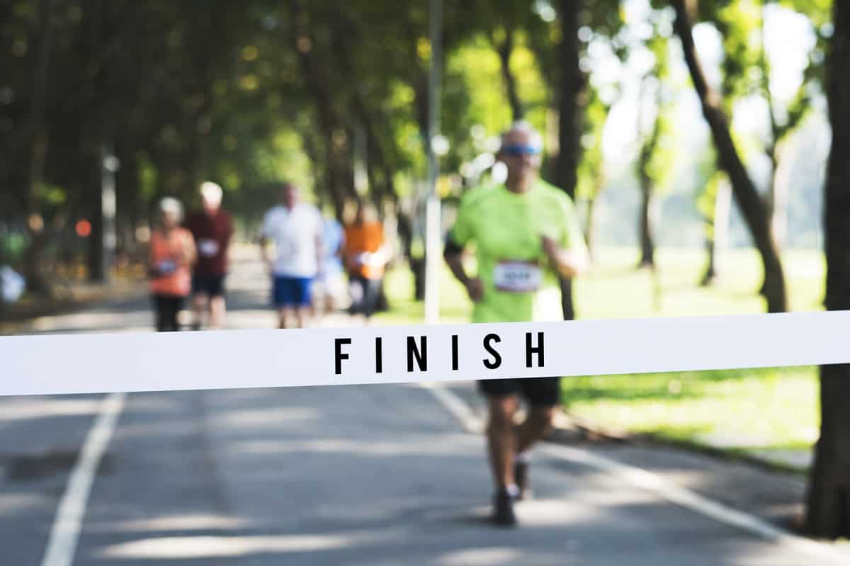 Runners getting close to the finish line of a half marathon race.