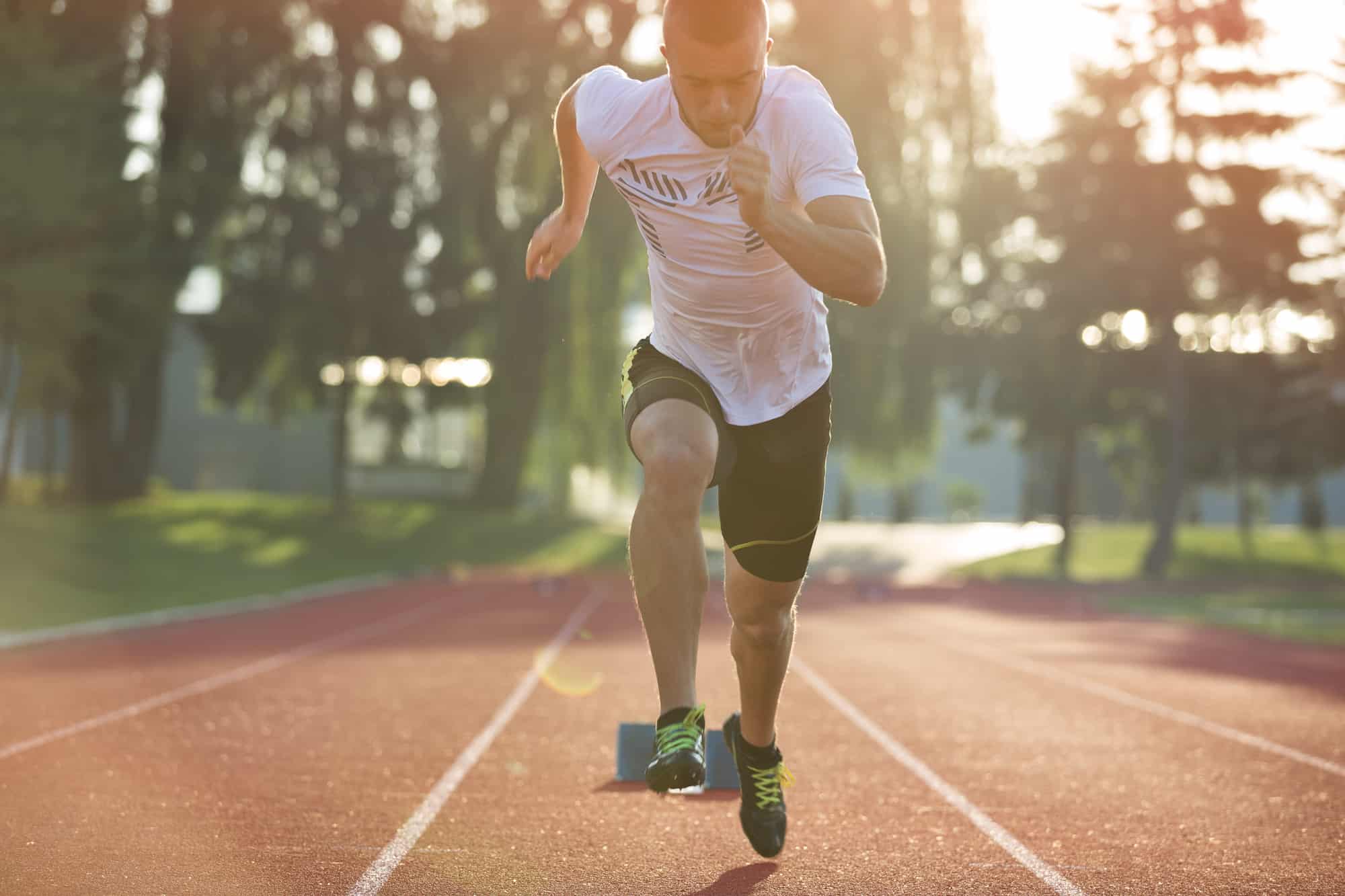 A sprinter just starting to run down a track.