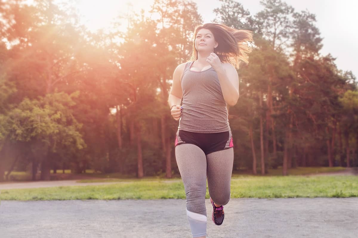 A beginner runner starting to jog in the park.