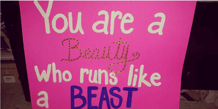 A running spectator sign that says you are a beauty who runs like a beast.