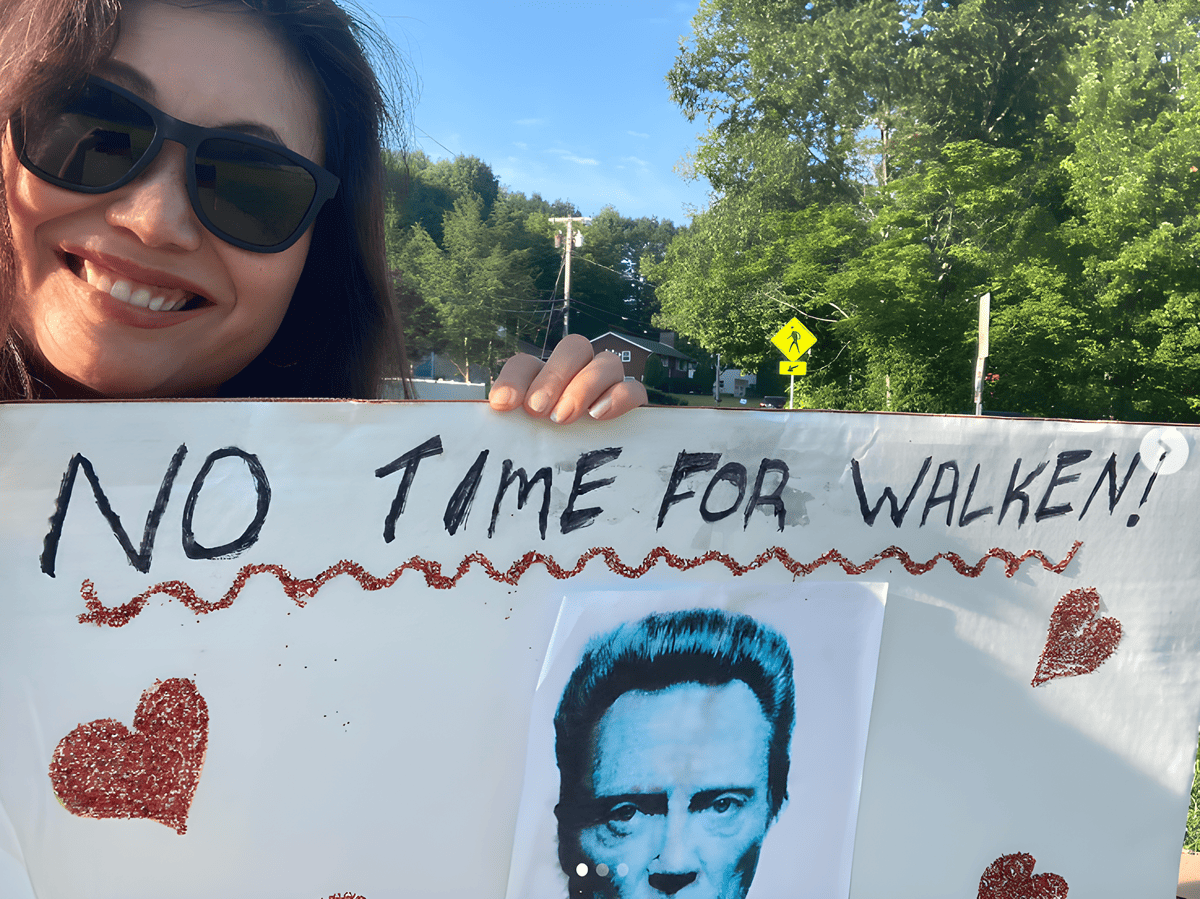 A sign at a race that says No Time for Walken, with a picture of Christopher Walken.
