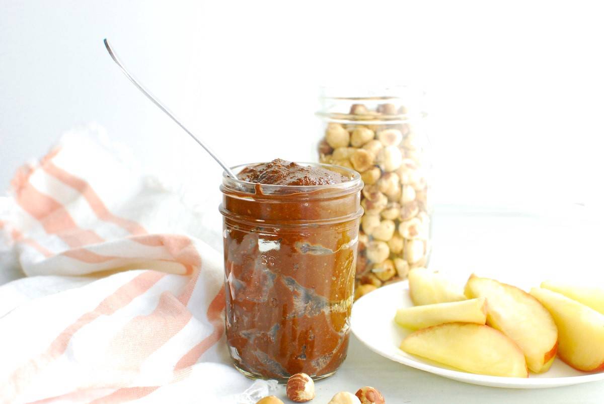 A jar of healthy homemade chocolate hazelnut spread.