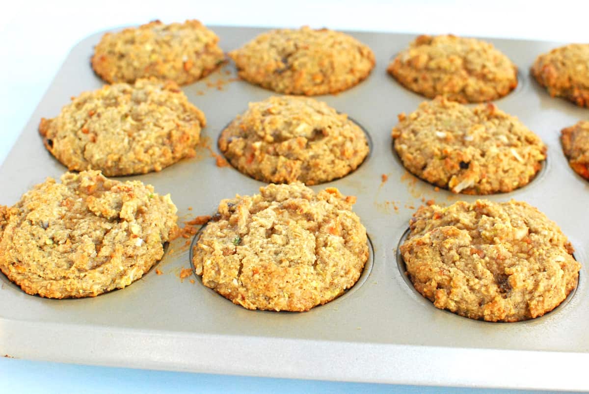 Healthy morning glory muffins that were just baked in a muffin tin.