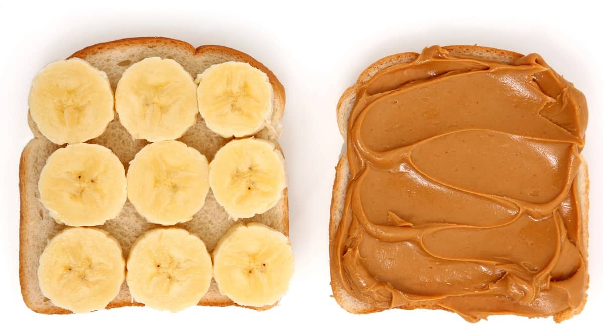 An open faced peanut butter and banana sandwich.