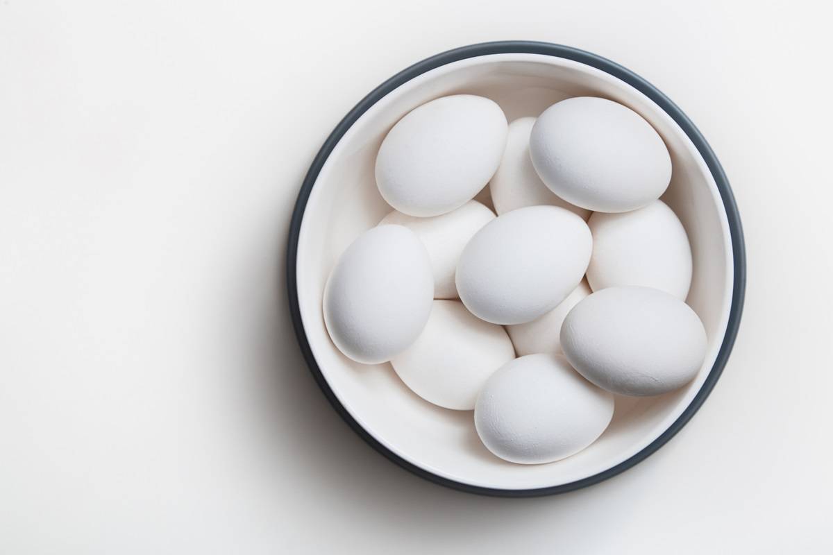 A bowl full of hardboiled eggs.