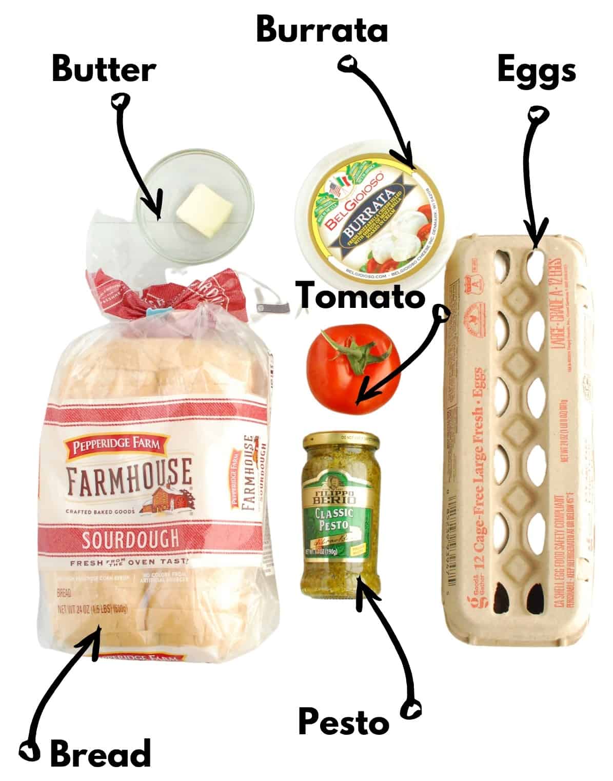 Bread, eggs, butter, pesto, tomato, and burrata on a white backdrop.