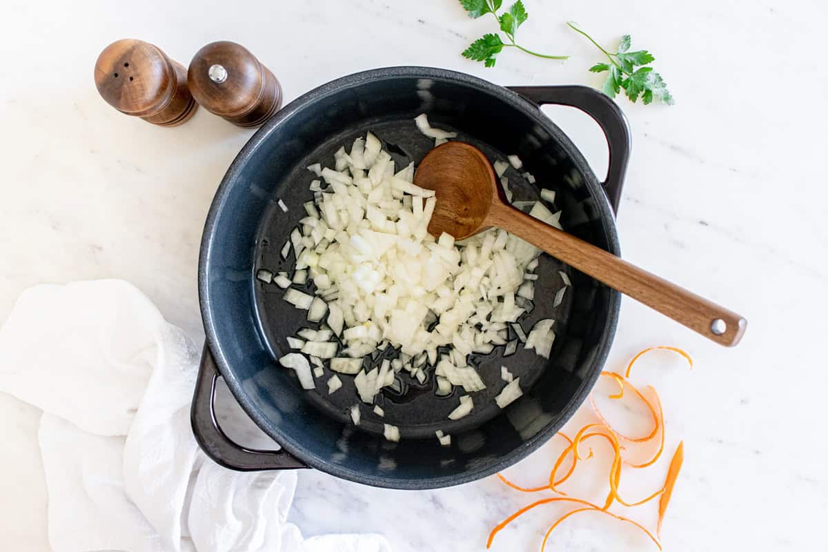 Onion sauteed in a pot.