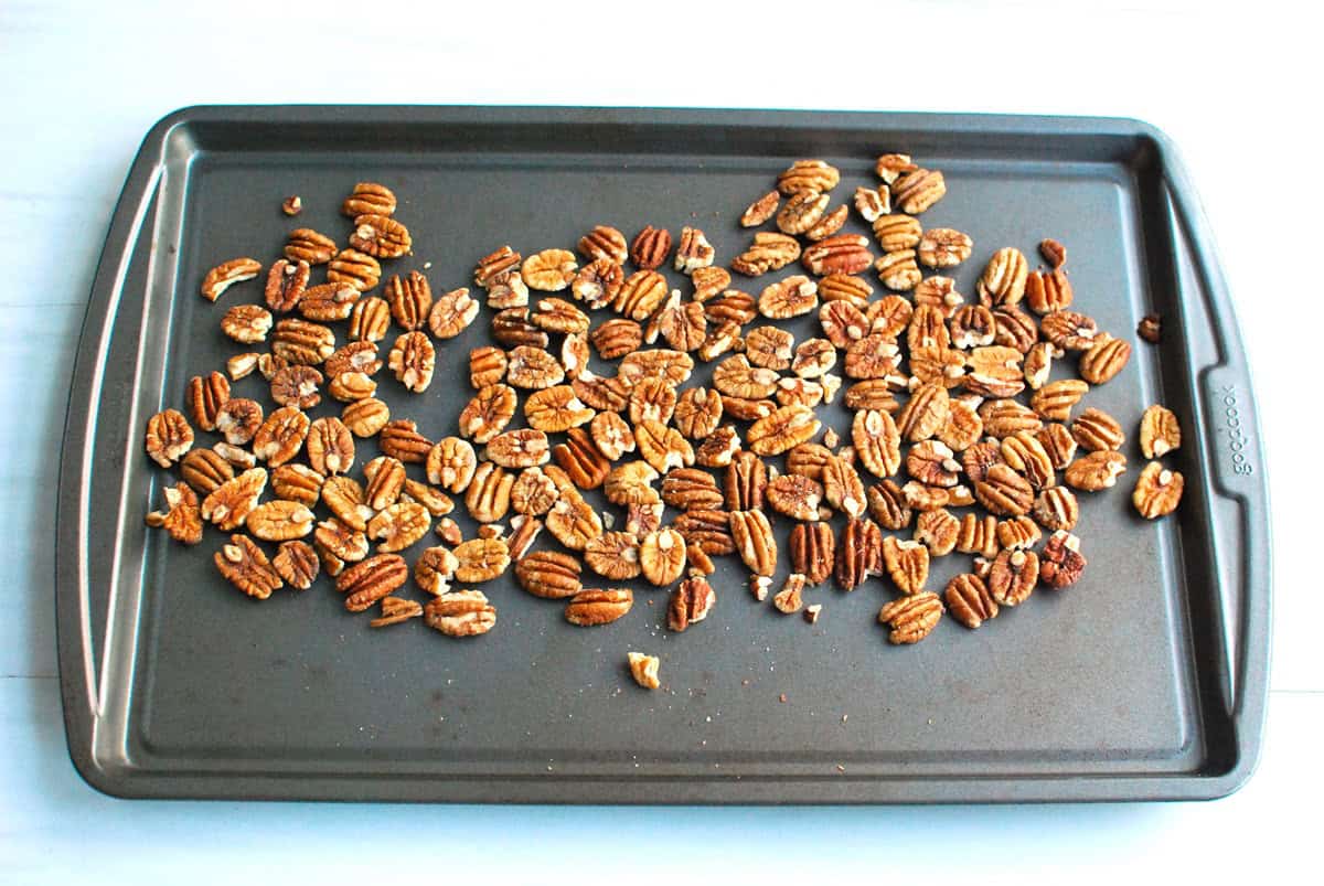 Pecans toasted on a baking sheet.