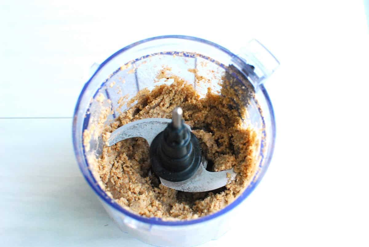 Macadamia pecan butter in a small food processor after 1 minute of blending.