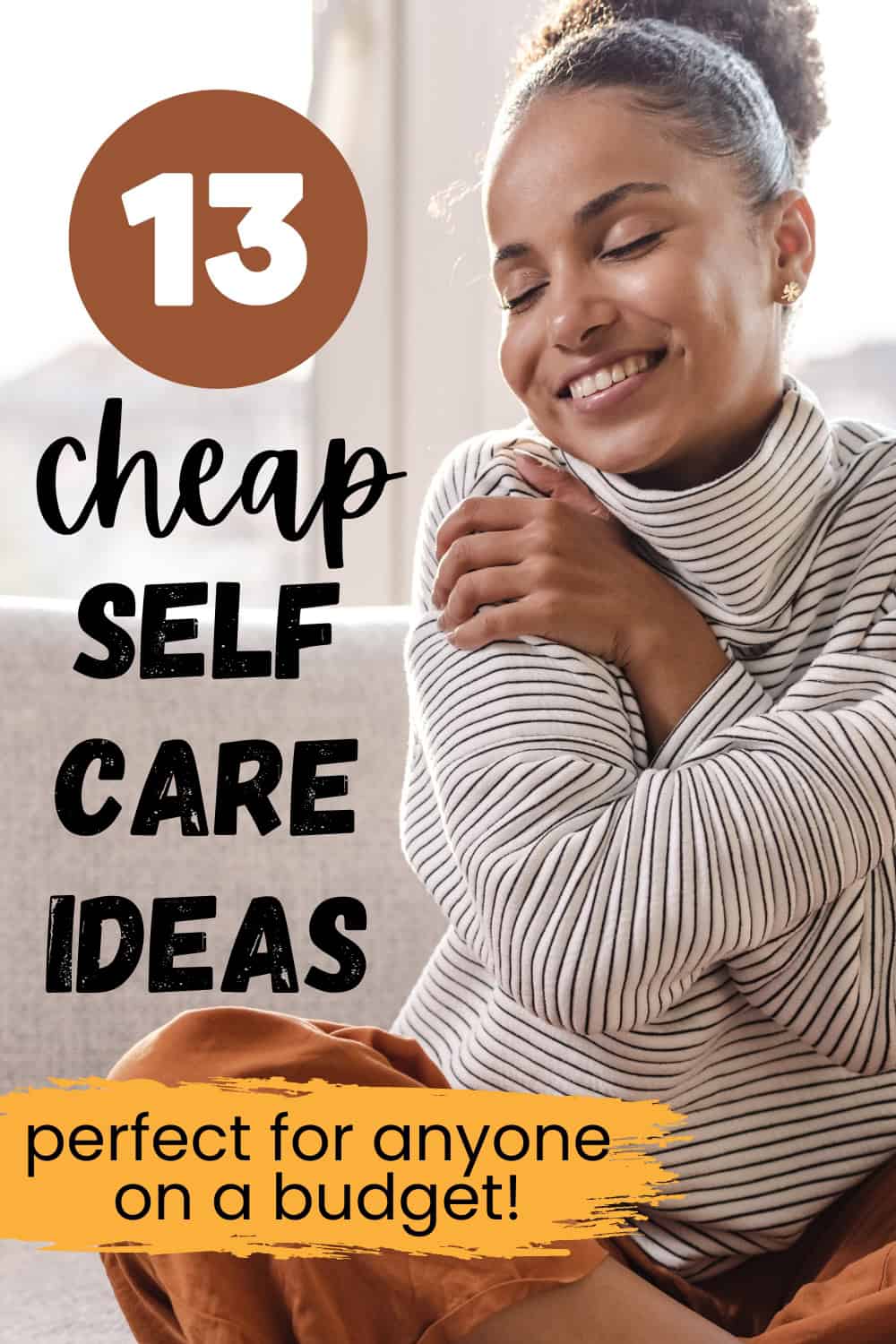A woman sitting on her couch hugging herself looking happy, with a text overlay that says 13 cheap self care ideas.