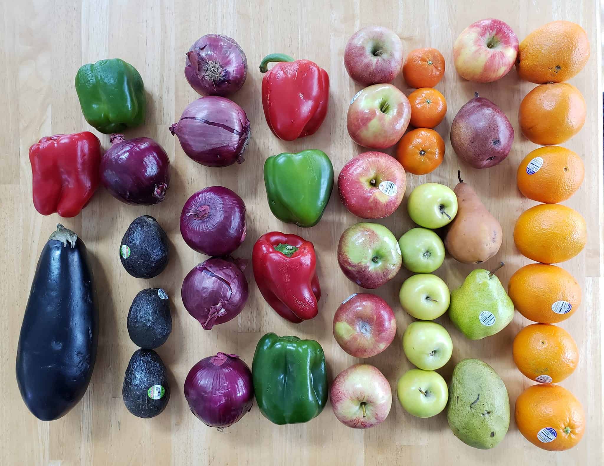 A ton of fruits and vegetables on a table.