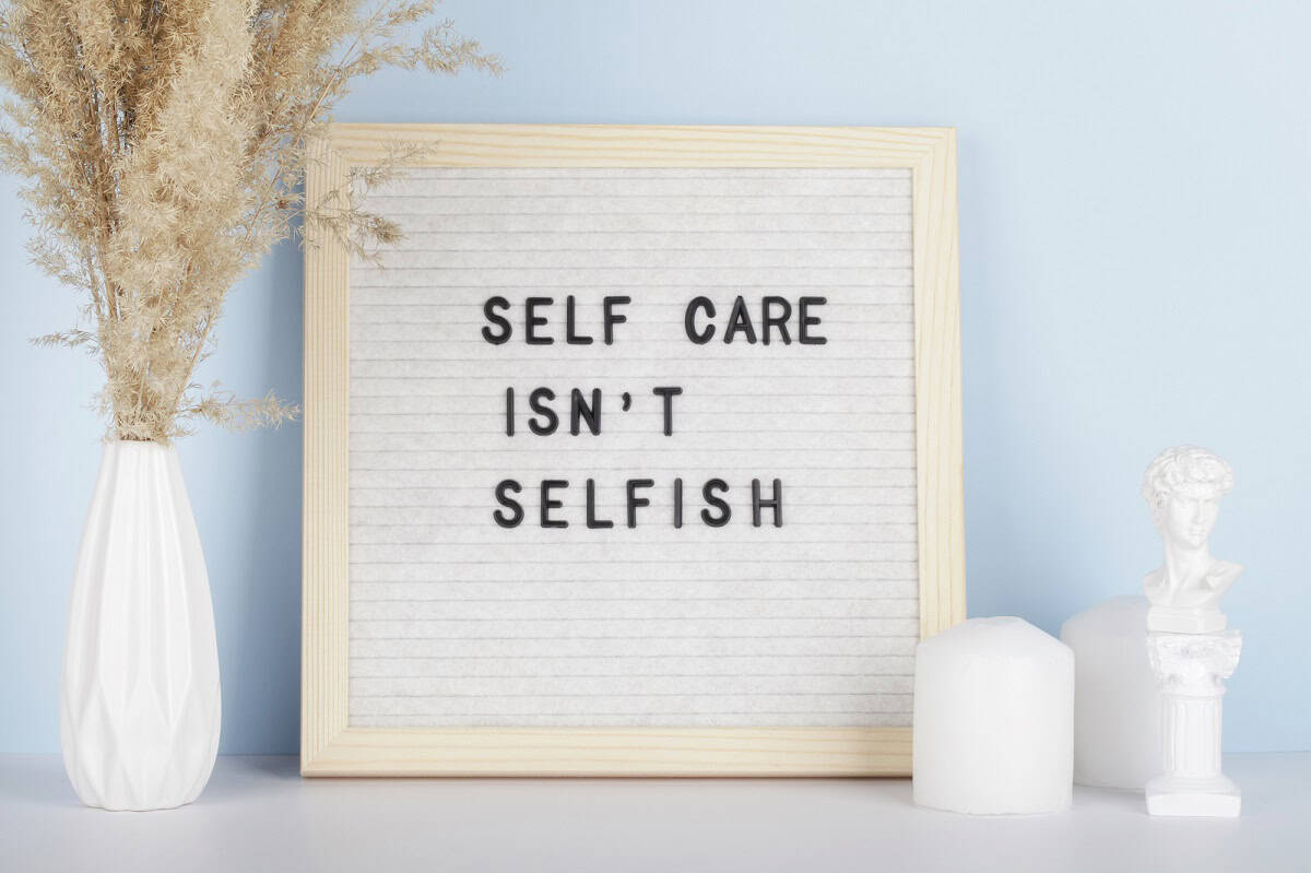 A letterboard sign that says self care isn't selfish.