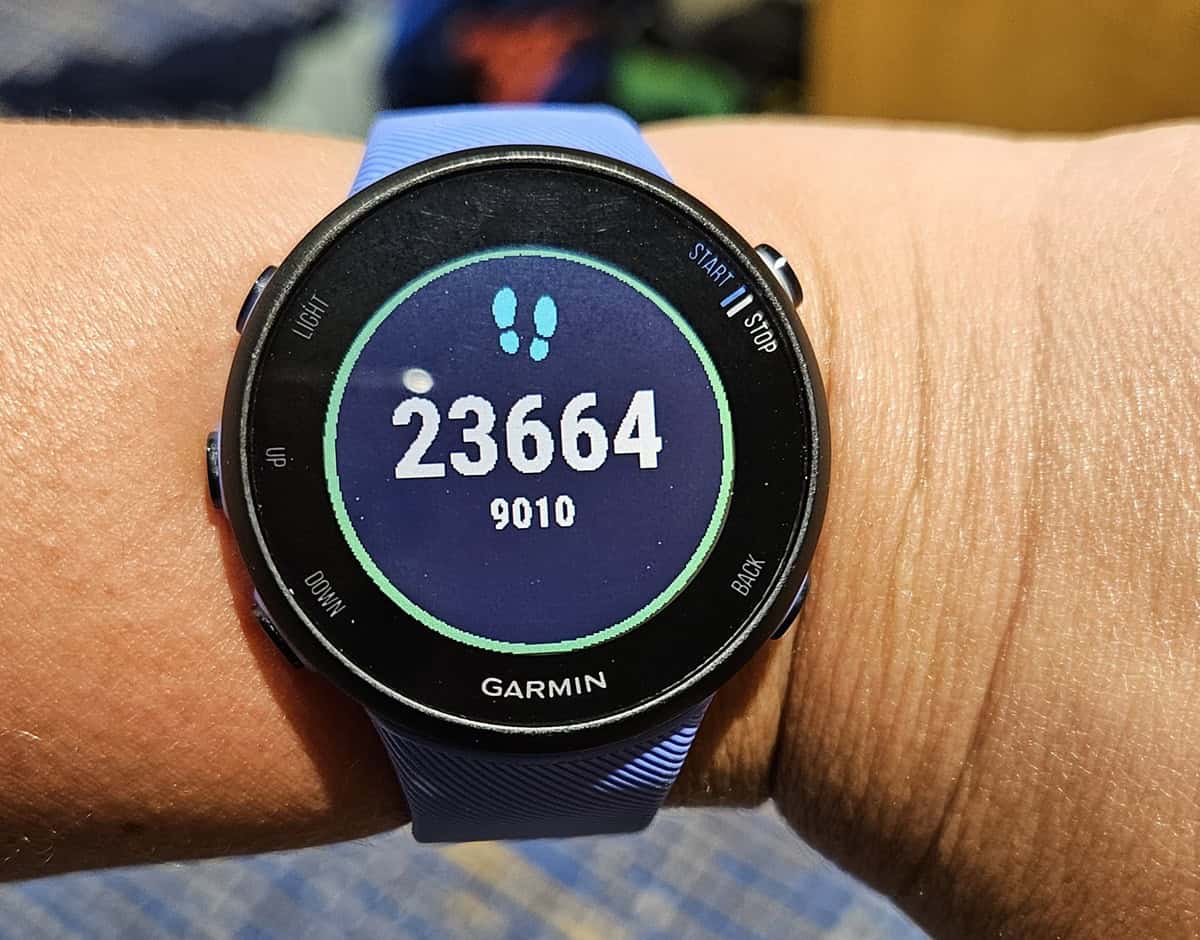 A watch showing 23,664 steps.