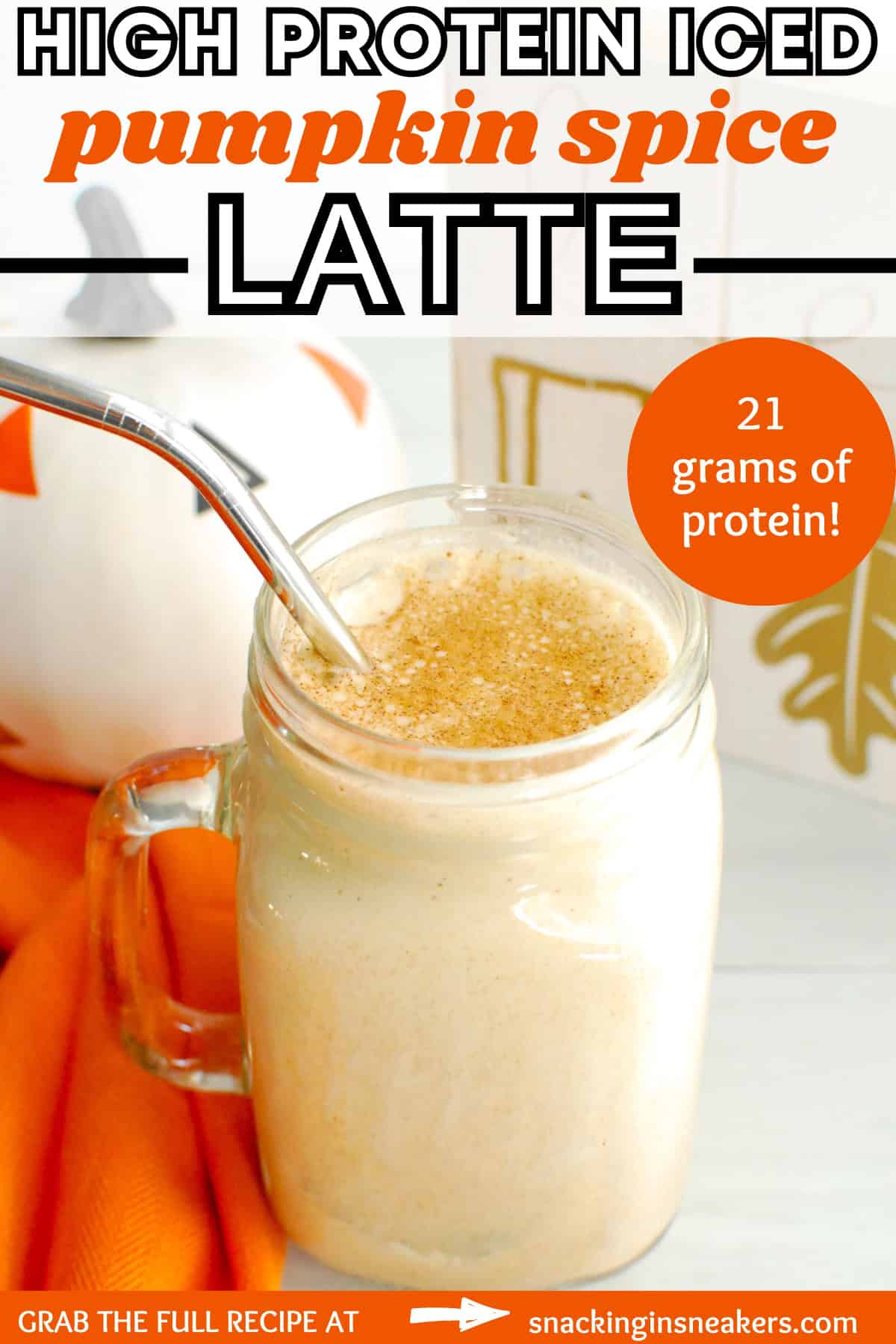 A glass cup full of high protein iced pumpkin spice latte, with a text overlay with the name of the recipe.