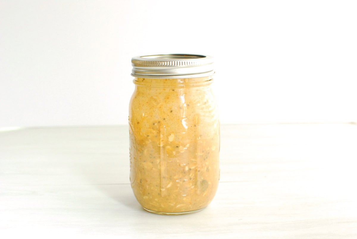 A mason jar full of pumpkin overnight oats.