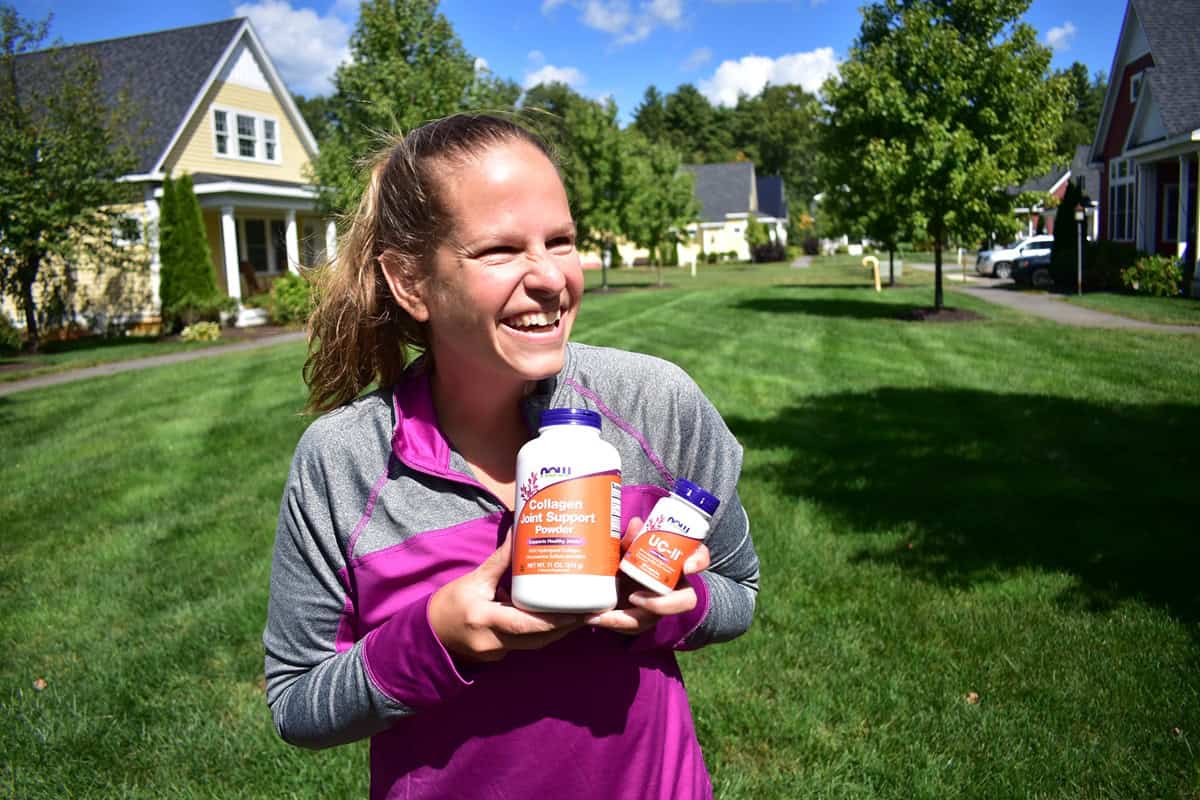 A woman holding two bottles of different types of collagen.