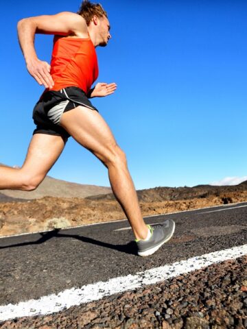 A man overstriding while running.