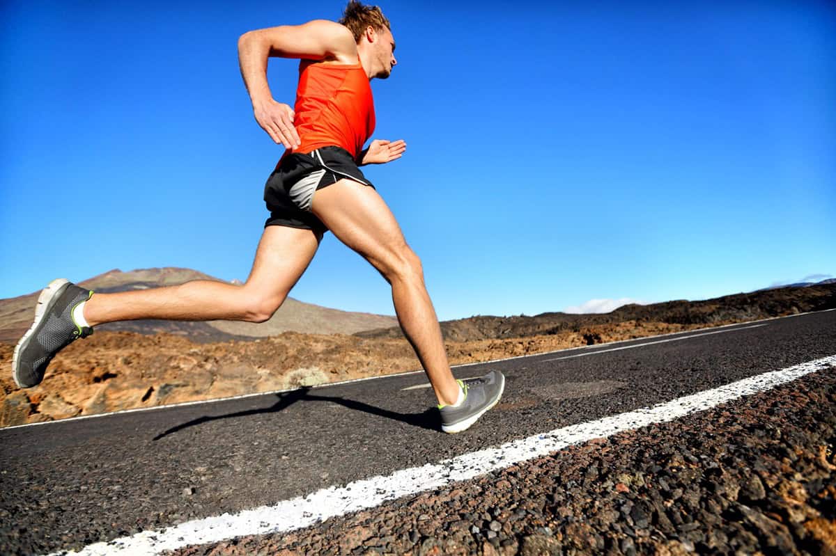 A man overstriding while running.