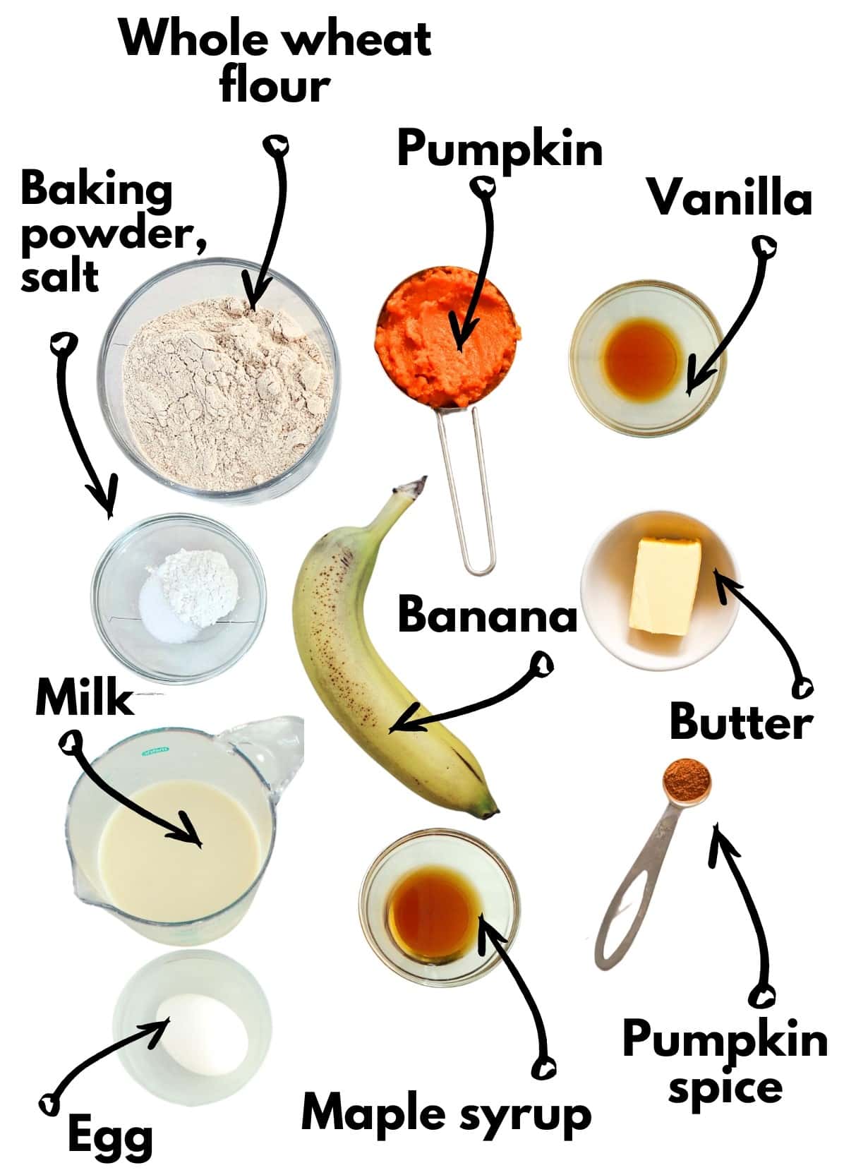 Whole wheat flour, pumpkin, banana, baking powder, milk, pumpkin spice, maple syrup, egg, vanilla, salt, and butter, all on a white backdrop.