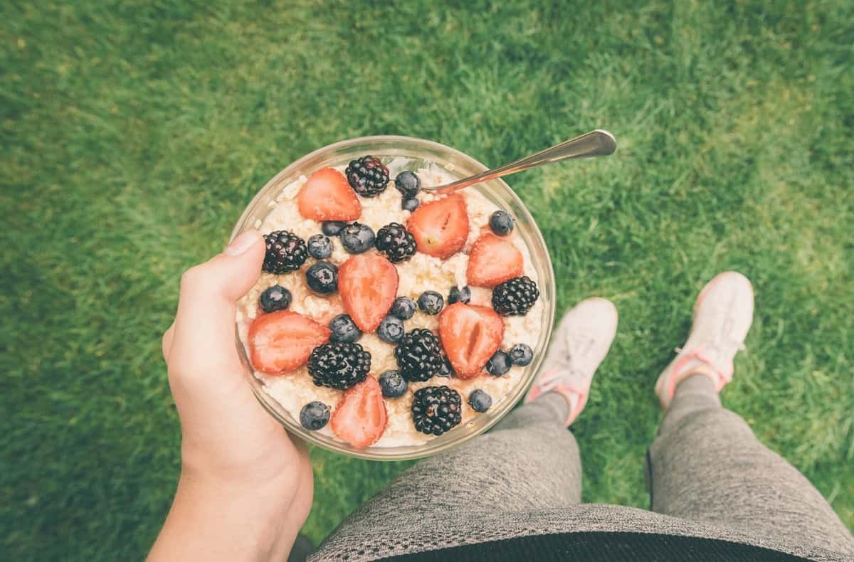 A female athlete with a big bowl of oatmeal.