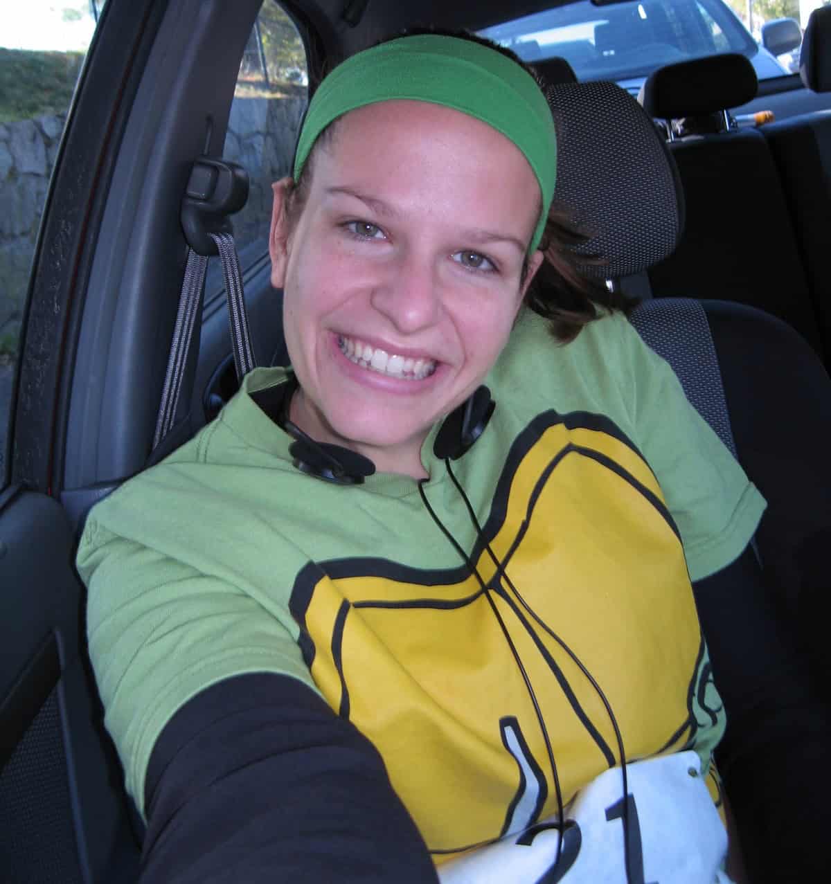 A woman with a ninja turtle t-shirt for a road race.