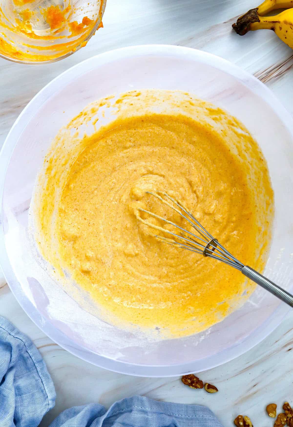 Pancake batter in a glass bowl.