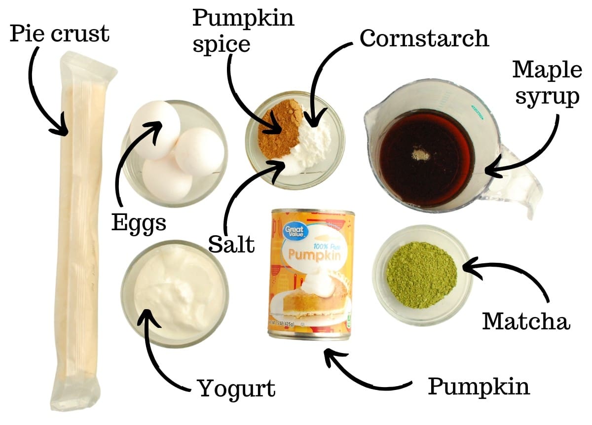Pie crust, eggs, yogurt, pumpkin, pumpkin spice, salt, cornstarch, matcha, and maple syrup, all measured on a white backdrop.