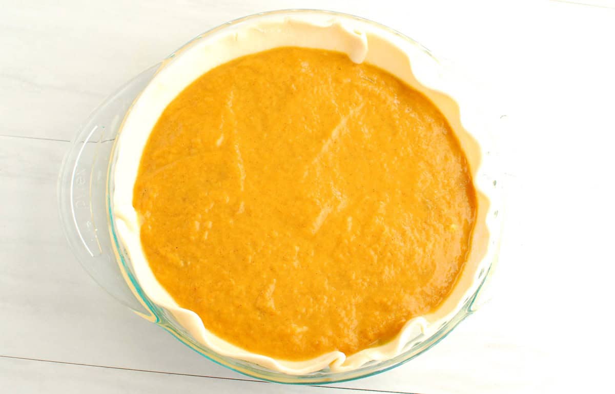 Pumpkin layer added on top of matcha layer in the pie crust.