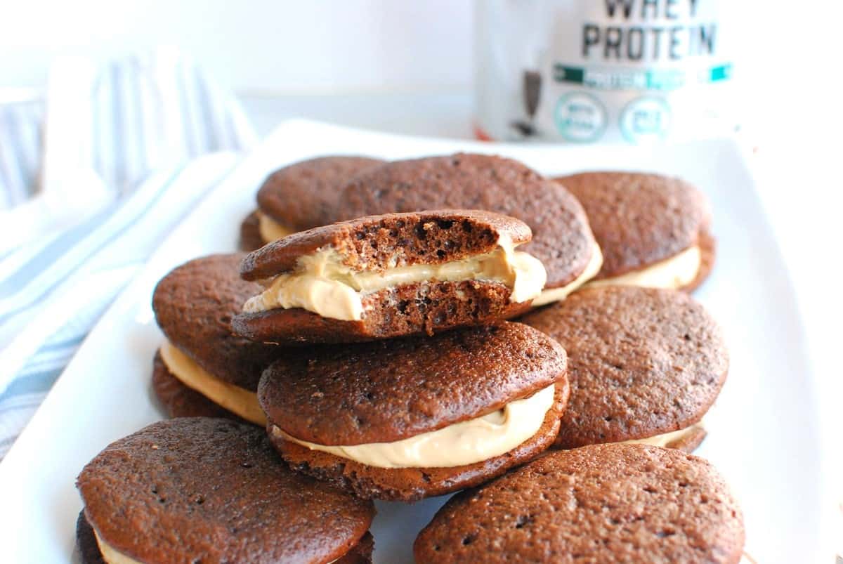 A bite taken out of a healthy whoopie pie showing the tender interior texture.