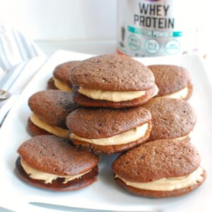 A bunch of protein whoopie pies on a white platter.
