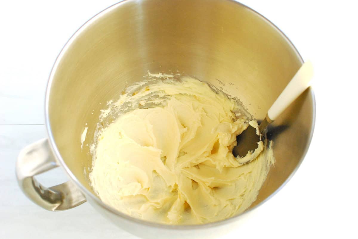 Vanilla and almond extract mixed into the bowl.