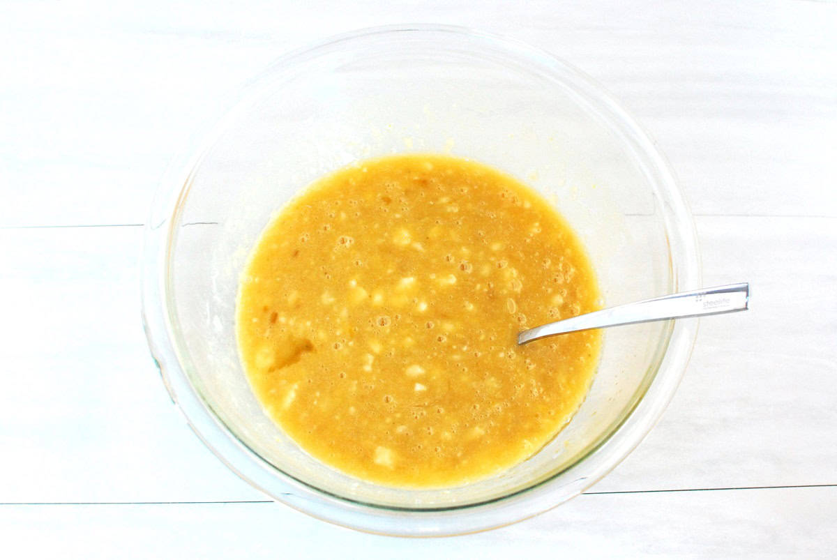 Bananas, olive oil, brown sugar, almond milk, egg, and vanilla combined in a bowl.