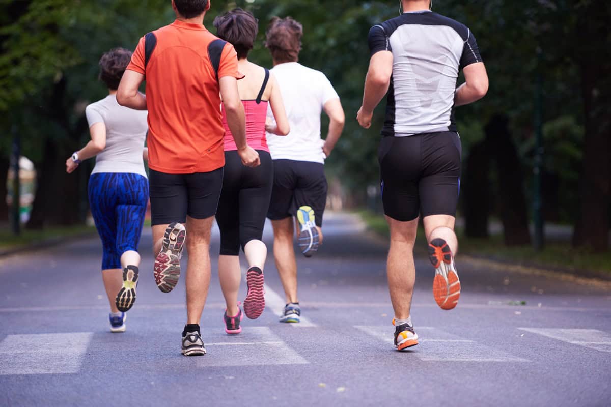 A group of people doing a 5K race.
