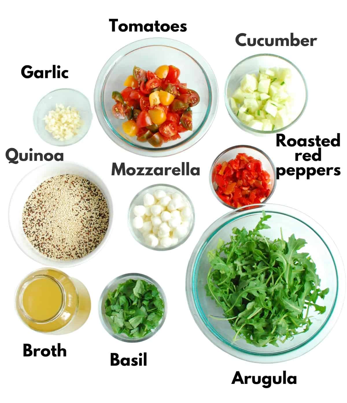 Garlic, tomatoes, cucumber, roasted red peppers, quinoa, mozzarella, arugula, broth, and basil.