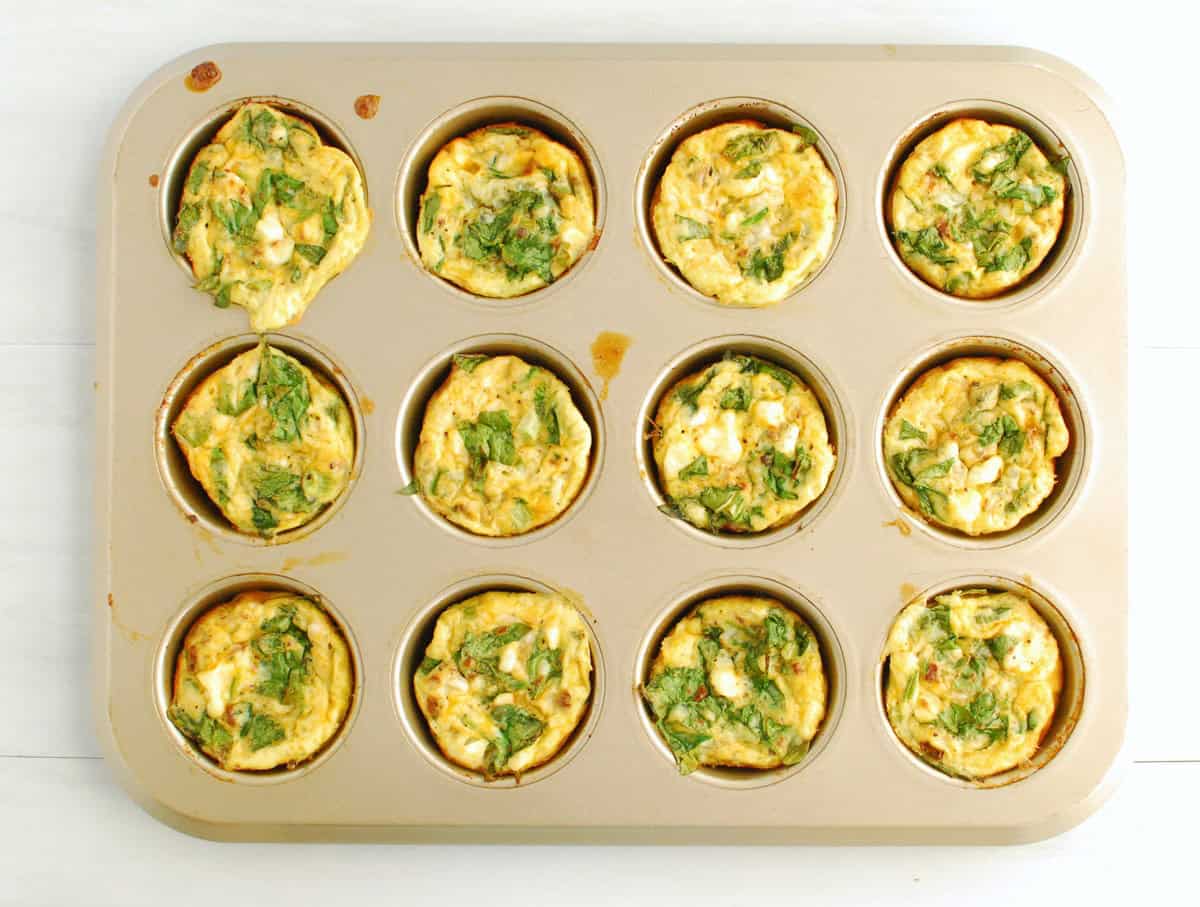 Just-baked cottage cheese egg muffins in a muffin tin.