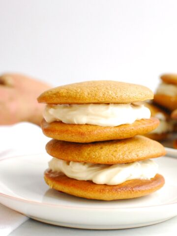 Two sweetpotato protein whoopie pies on a small plate.