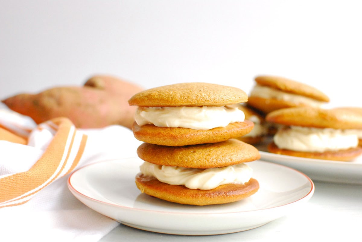 Two sweetpotato protein whoopie pies on a small plate.