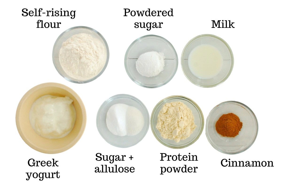 Self-rising flour, protein powder, greek yogurt, sugar, allulose, cinnamon, powdered sugar, and milk.