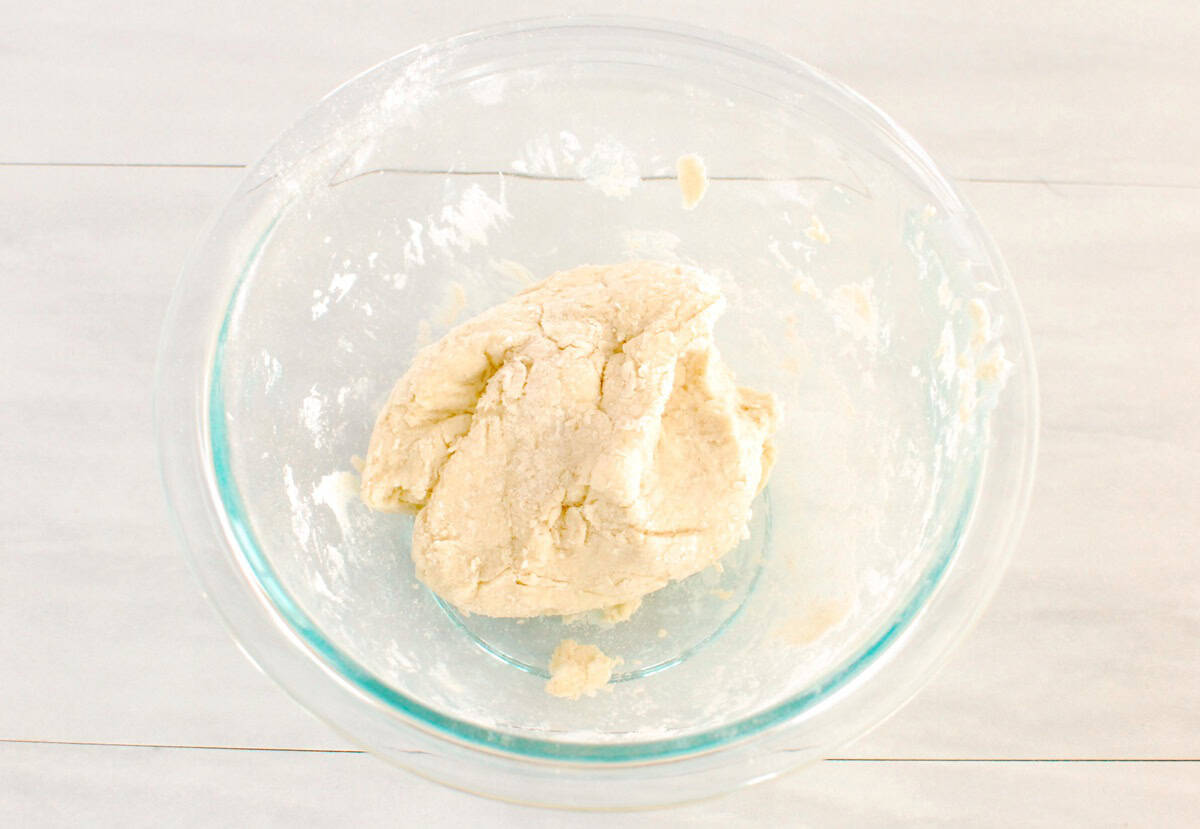 Dough made from self-rising flour, protein powder, and Greek yogurt, in a mixing bowl.